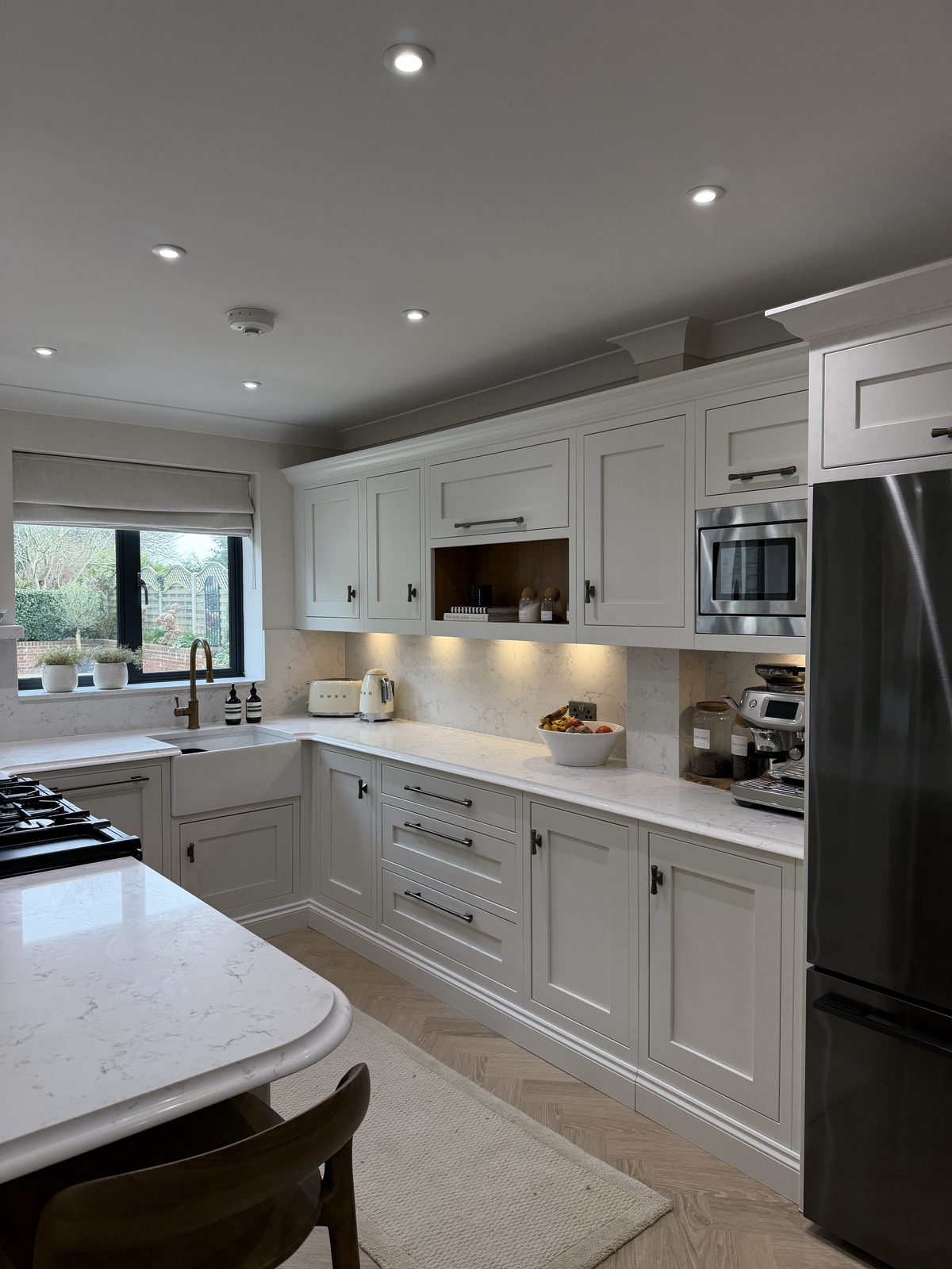 A finished Purple Granite kitchen with quartz worktops and island